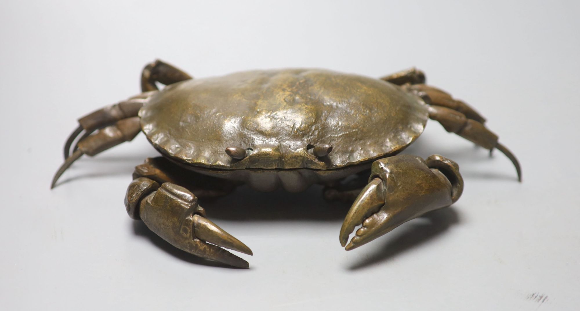 A mid 20th century bronze articulated model of a crab, with hinged carapace, 26cm across